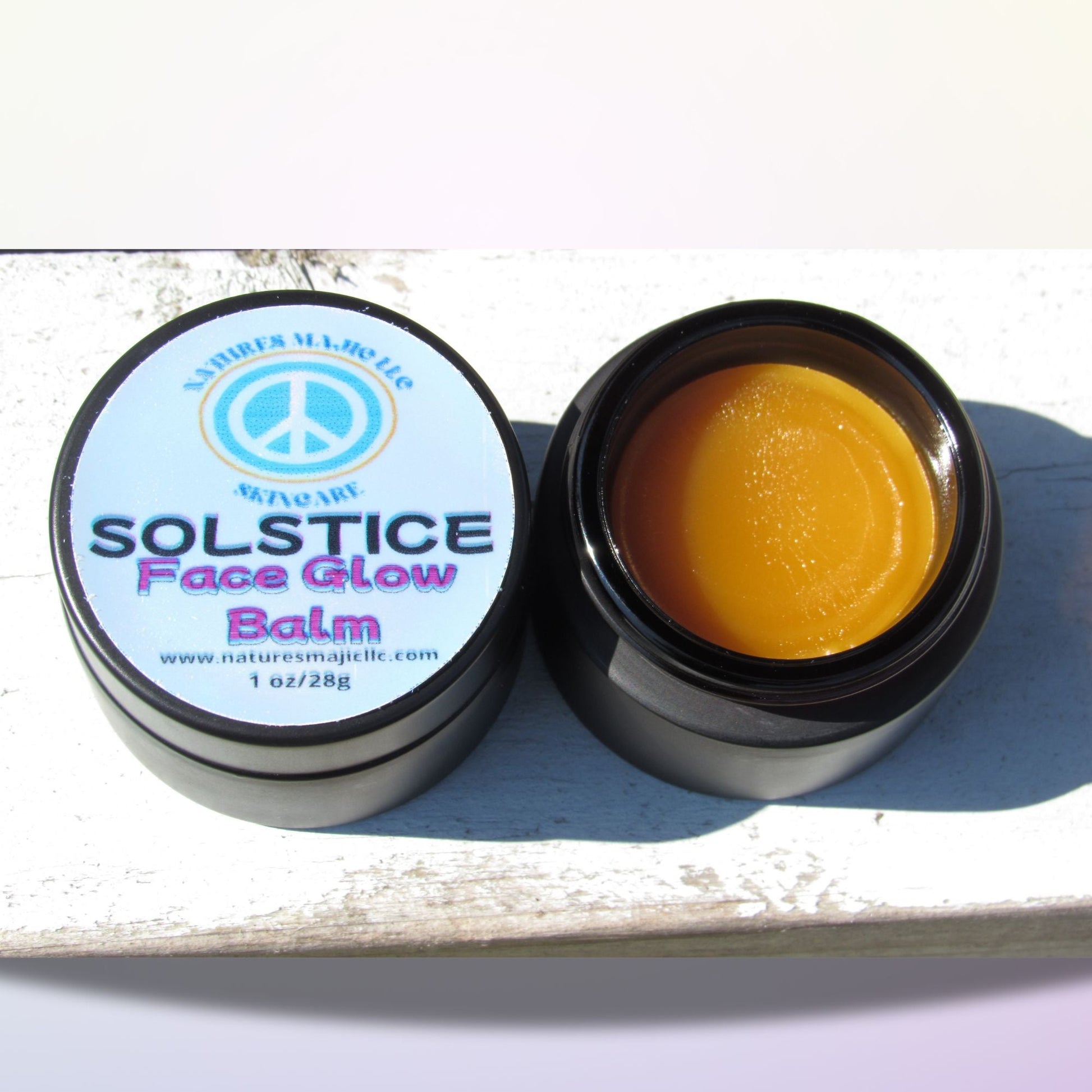 Solstice Face Glow Balm in black glass jar with yellow balm for nourishing dry, sensitive skin