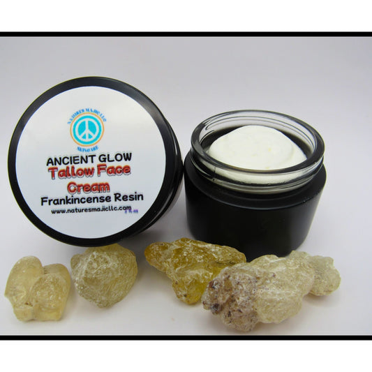 Ancient Glow Face Cream in black jar with frankincense resin pieces, natural tallow moisturizer for skin nourishment and anti-aging benefits