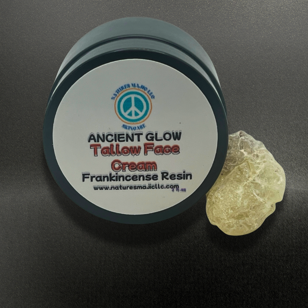 Ancient Glow Face Cream jar with frankincense resin on black background natural skin moisturizer