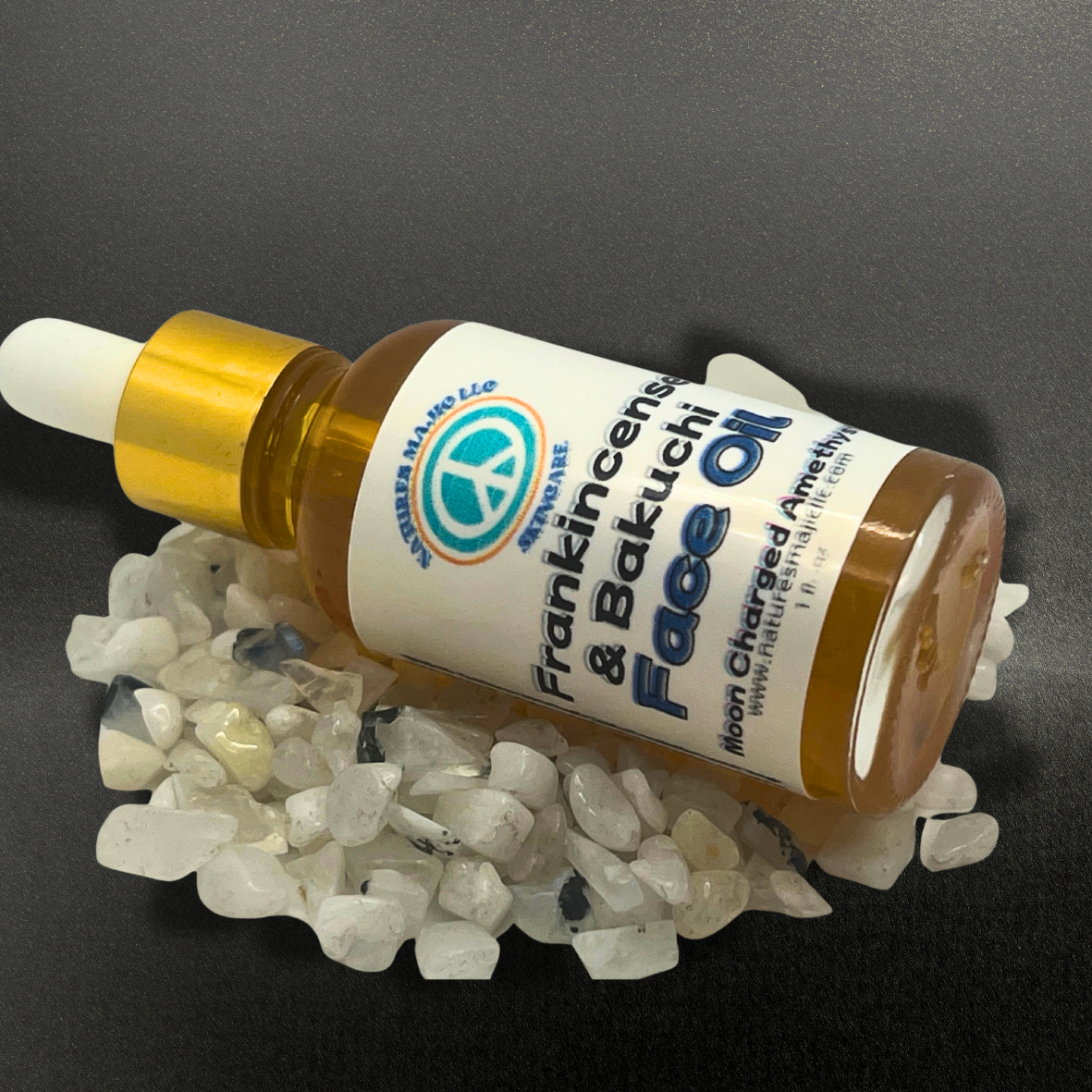 Frankincense resin infused Bakuchi face oil bottle with dropper on white stones for natural anti-aging skincare