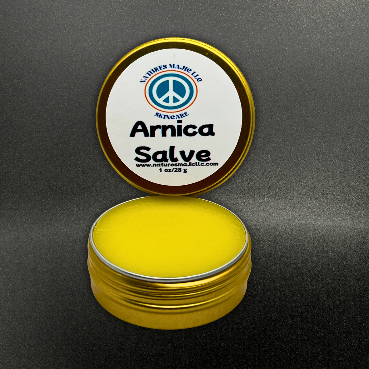Arnica Salve in gold tin with yellow balm for muscle and joint relief by Natures Majic
